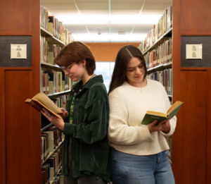 2 book readers in library