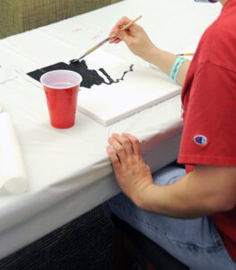 Students painting at new art club