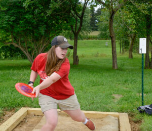 disc golfer on LBC's course, Red Tail Run