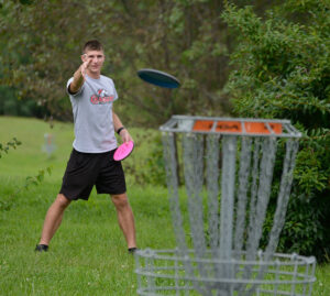 disc golfer on LBC's course, Red Tail Run