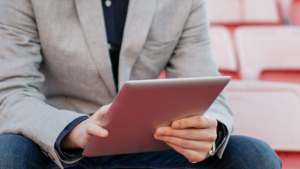 A person looking at the tablet. 