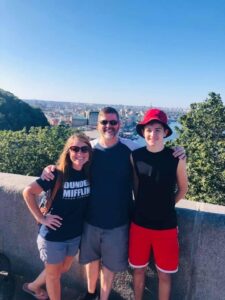 Tracy and Chris Scoggins pose with their son in Kyiv.