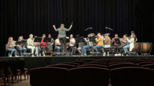 Rechel Sidebothom ('02) conducts the Community Band for its November 2022 concert in Good Shepherd Chapel.