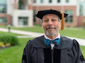 Dr. Barry Davis at LBC graduation, with his bow tie, of course