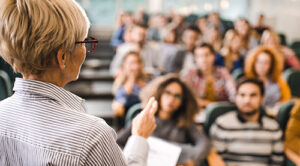 female professor at head of class