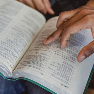 professor pointing to bible