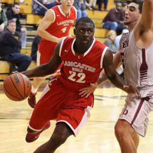 Herbie Brown, a standout on the Charger basketball team, drives to the hoop.