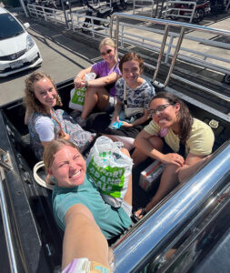 thailand team traveling in the back of a truck