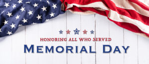 Happy memorial day concept made from american flag with text over white wooden background.