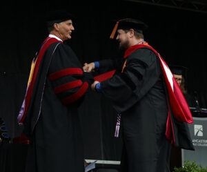 Dr. Richard Floyd receives his diploma from LBC President Dr. Tommy Kiedis.