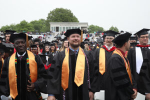 Dr. Richard Floyd stands with some of his other doctoral peers on graduation day, May 4, 2024.