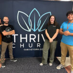 From left, Brittney (Becker ’12) Boosz, BJ Boosz (’11 & ’12), Rebekah LeCates ('23) and Sam Edwards ('25) serve together at Thrive Church in York, Pa.