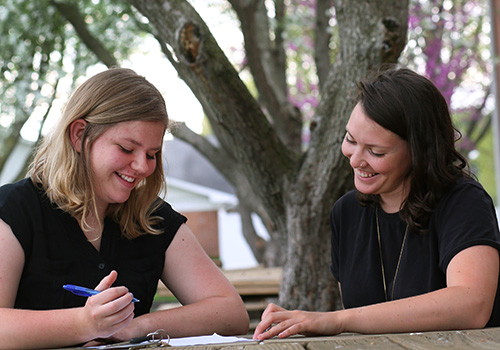 A student receiving academic mentorship.