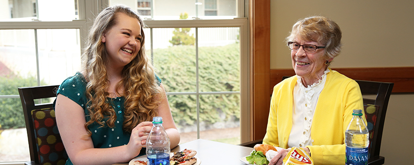 Two women having a cheerful conversation.