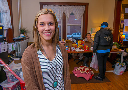 A social work student working at a community aid ministry