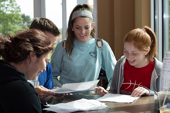 Students studying papers.