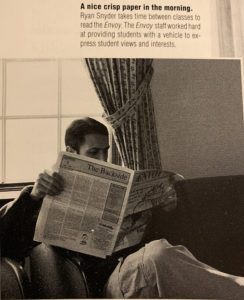 In 1999, Ryan Snyder reads a copy of the Envoy, the name of the student newspaper on campus at that time.