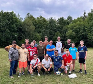 Volunteers who who led a soccer tournament gather after a time of fellowship and fun.